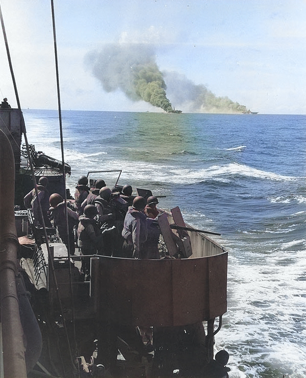 Mugford escorted carriers Belleau Wood and Franklin, both damaged by special attack aircraft, off Philippine Islands, 30 Oct 1944; note Mugford's midships 20mm gun crews [Colorized by WW2DB]