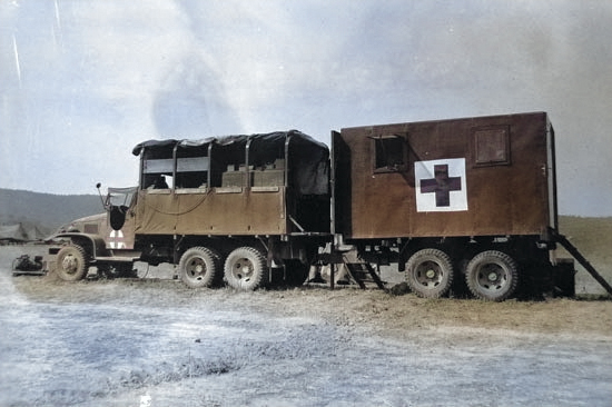 US Army CCKW 2 1/2-ton 6x6 cargo truck pulling rear half of another, forming the Mobile Optical Section of the 12th Medical Depot Company, US 5th Army, Volterro, Italy, 9 Aug 1944 [Colorized by WW2DB]