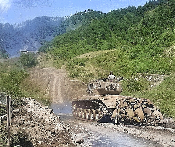 US Marines crouching behind a M26 Pershing tank, near Hongcheon, Korea, 22 May 1951 [Colorized by WW2DB]