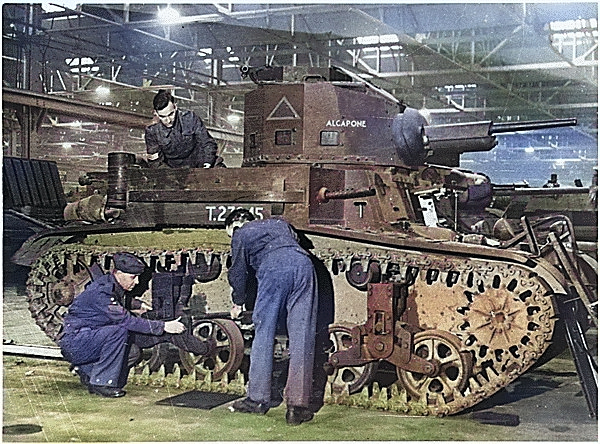 British workers working on a M2A4 light tank that had just arrived from the United States, circa 1941 [Colorized by WW2DB]