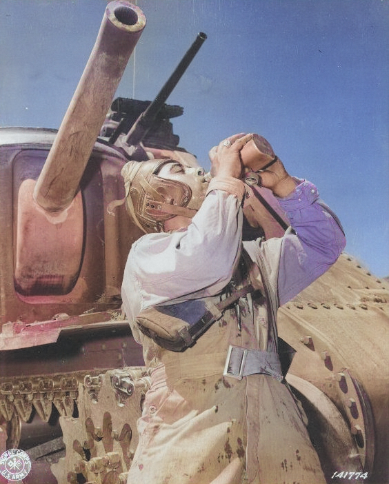 Corporal Philip Margherito of HQ Company, US 752nd Tank Battalion drinking water during a M3 medium tank training mission, Desert Training Center, Indio, California, United States, 10 Jun 1942 [Colorized by WW2DB]
