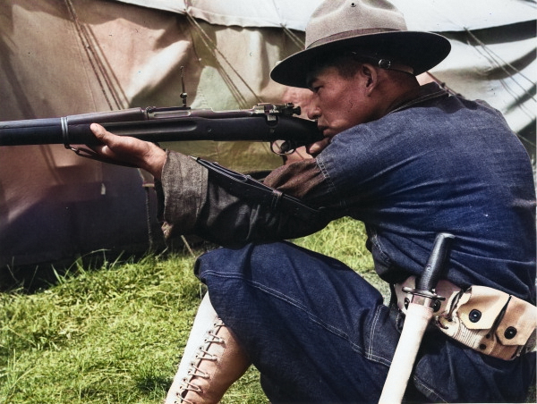 Japanese-American recruit learning how to use the Springfield M1903 rifle, US Territory of Hawaii, date unknown [Colorized by WW2DB]