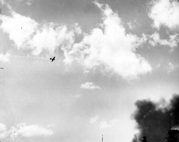 A damaged Zero fighter left a trail of smoke above Pearl Harbor, US Territory of Hawaii, 7 Dec 1941