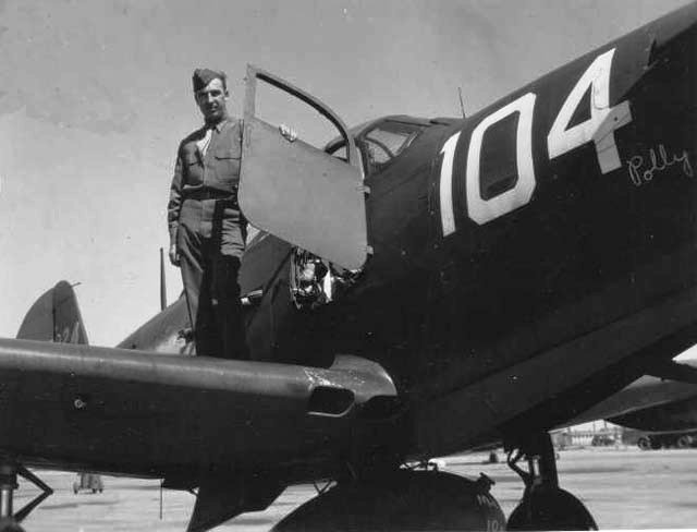 P-39 Airacobra fighter with its pilot, date unknown; note the unique 'car-door' style entrance into cockpit