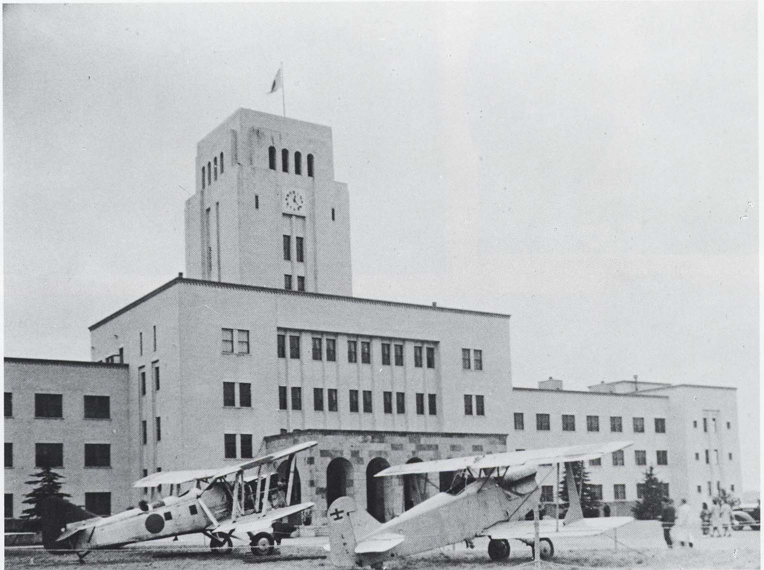 B2M (left) and another aircraft at rest before the main building of Tokyo Institute of Technology, Meguro, Tokyo, Japan, 1940; seen in the publication 'Youth of the Old University System' dated 20 Jan 1984