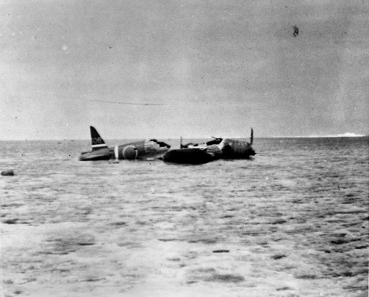 B5N2 torpedo bomber wreckage sitting atop Indispensable Reef as it was found on 9 Jun 1942; she was lost during the Battle of Coral Sea