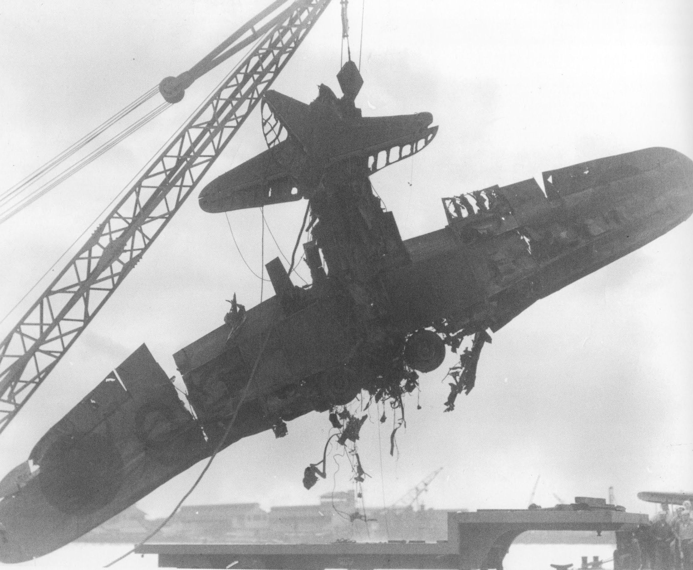 A destroyed Japanese B5N torpedo bomber, flown by Lieutenant Mimori Suzuki of carrier Kaga, being recovered by the Americans in US Territory of Hawaii, Dec 1941