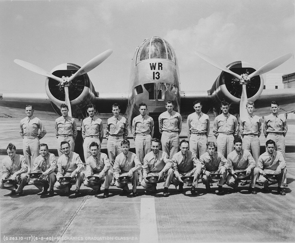Aircraft Mechanic Class 2A posing for their graduation photo in front of a B-18 Bolo bomber at Hickam Field, Oahu, US Territory of Hawaii, 5 Jun 1940