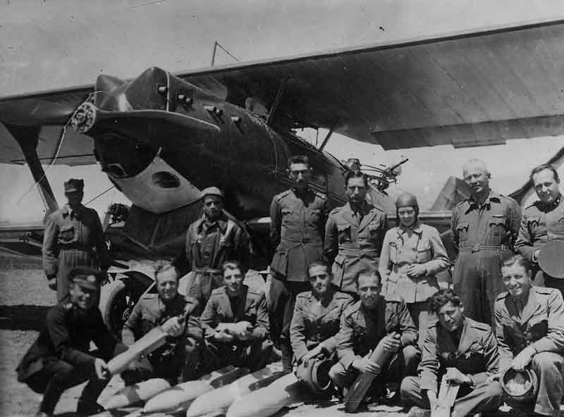 Turkish female aviator Sabiha Gökçen and others posing before a Bre.19 light bomber, 1937-1938