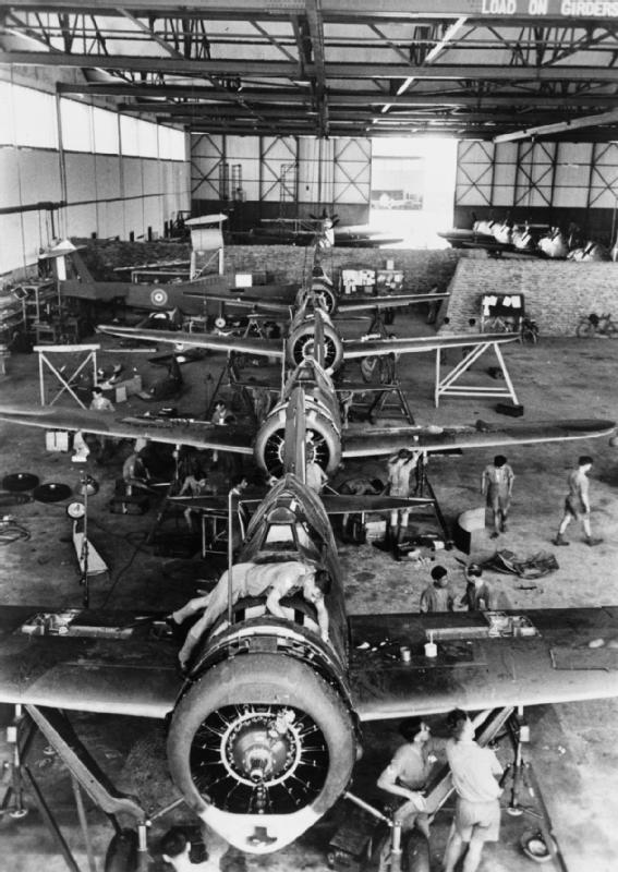 British mechanics assembling Buffalo fighters, Singapore, circa 12 Aug 1941
