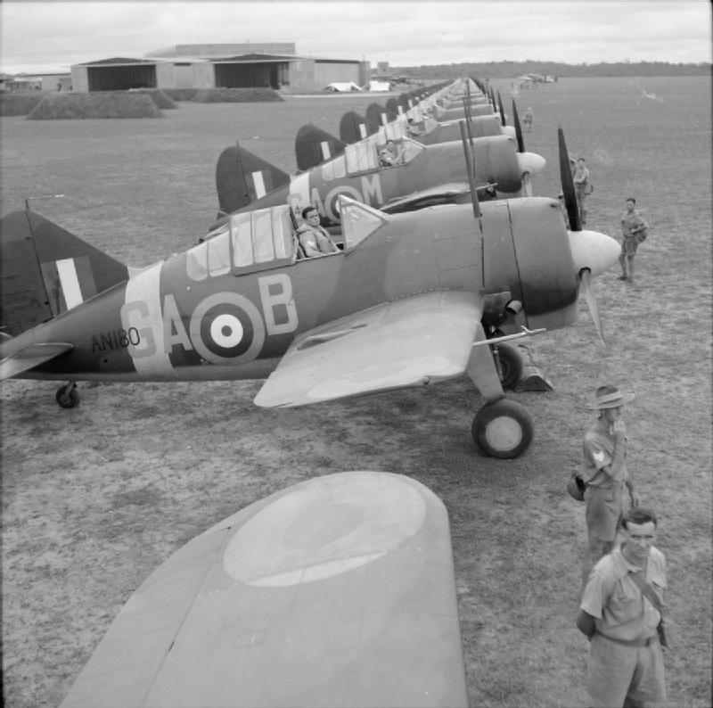 Buffalo Mark I fighters of No. 21 Squadron RAAF lining up at Sembawang, Singapore for inspecting by Air Vice Marshal C. W. H. Pulford, Nov 1941