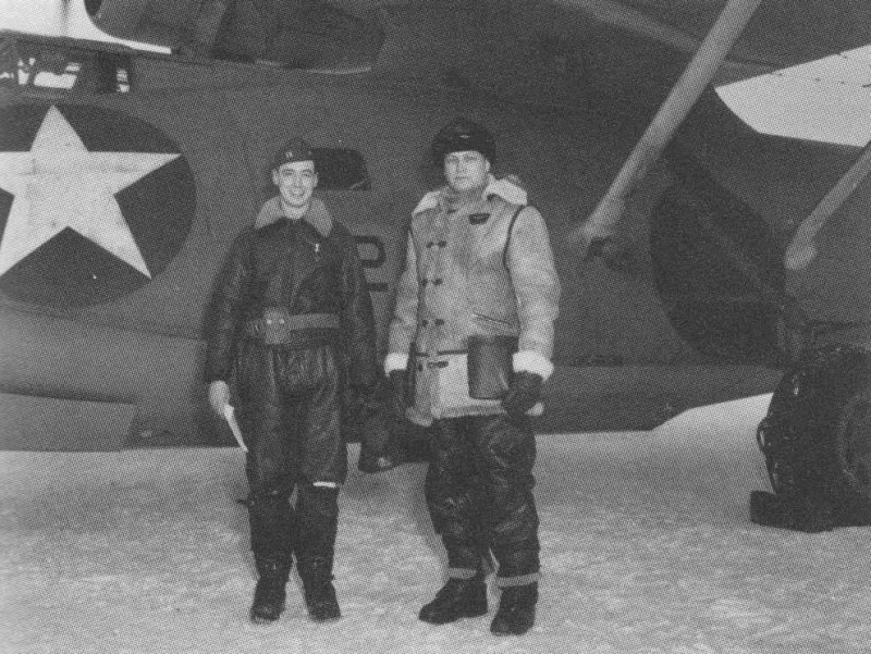 US Navy Lieutenant William Thies (pilot, VP-41) and Captain Leslie Gehres (Commander, Fleet Air Wing 4) standing in front of Thies' PBY Catalina aircraft, Aleutian Islands, US Territory of Alaska, 1942