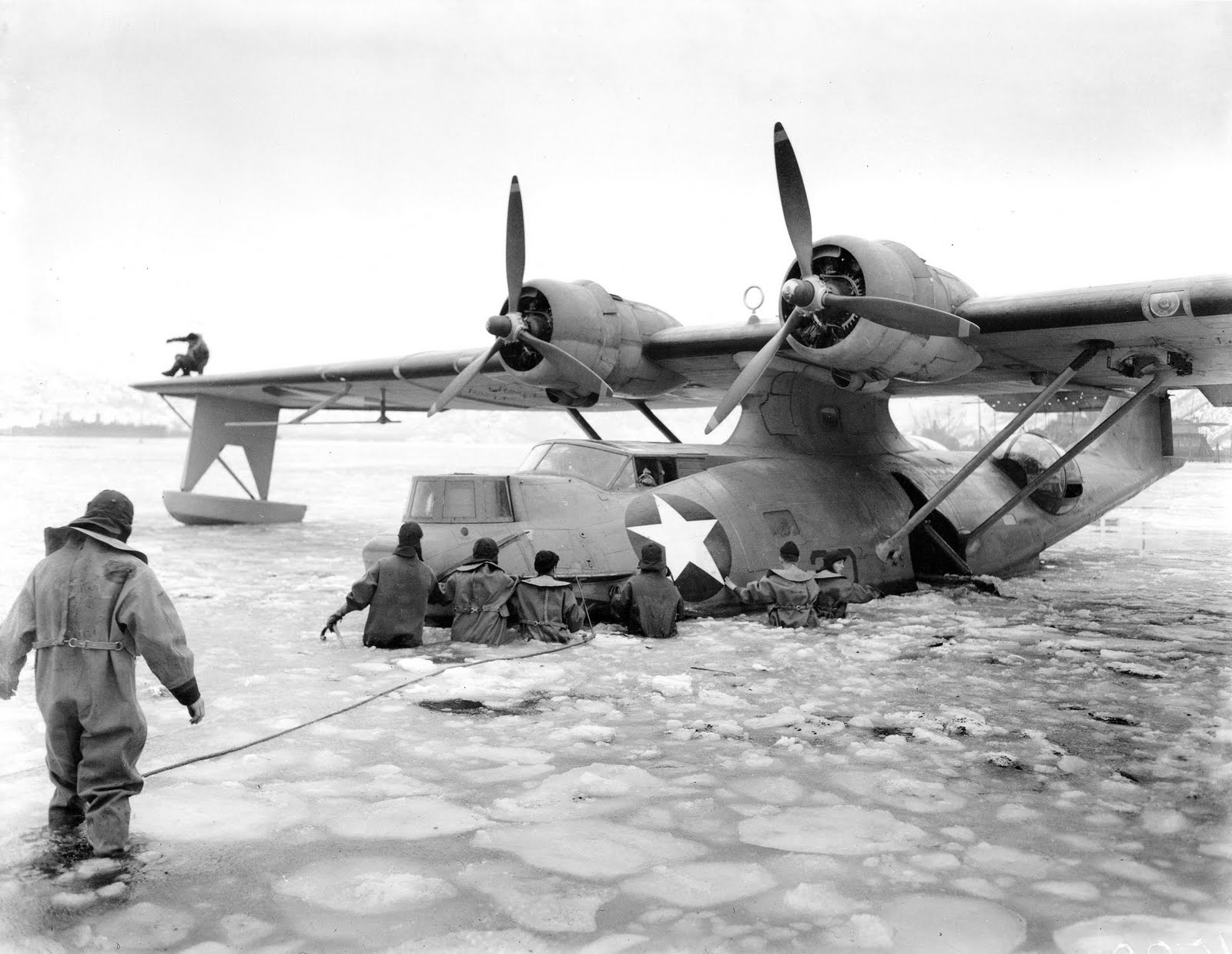 US Navy personnel freeing a PBY-5A Catalina aircraft from frozen waters in the Aleutian Islands at Kodiak Bay, US Territory of Alaska, May 1942-Jan 1943