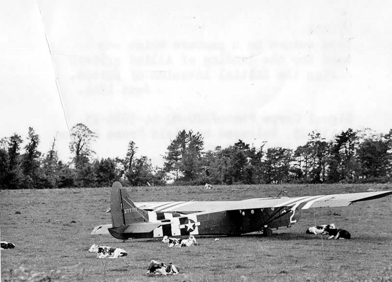 Ford-built CG-4A glider sitting in a pasture, Normandy, France, Jun 1944