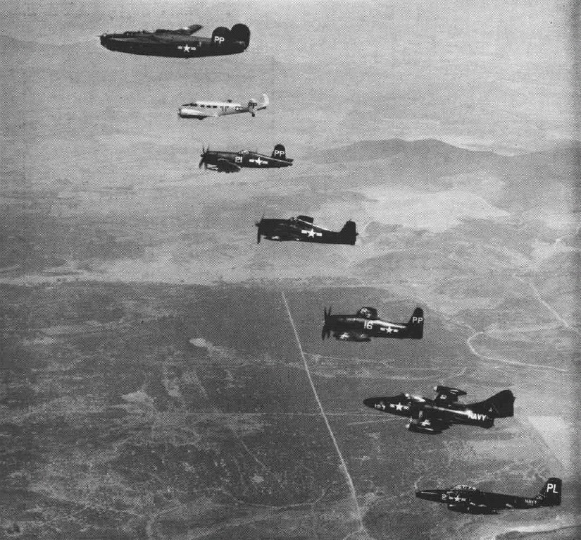 US Navy P4Y1P Liberator, SNB-2P, F4U-5P Corsair, F6F-5P Hellcat, F8F-2P Bearcat, F9F-5P Panther, and F2H-2P Banshee aircraft in flight, circa 1952; seen in Aug 1952 issue of US Navy publication Naval Aviation News