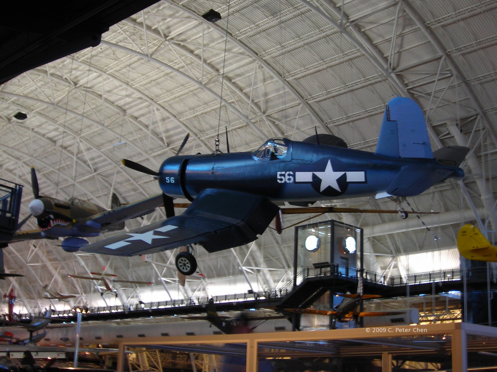F4U Corsair fighter on display at the Smithsonian Air and Space Museum Udvar-Hazy Center, Chantilly, Virginia, United States, 26 Apr 2009, photo 2 of 2; note P-40E Warhawk fighter in background