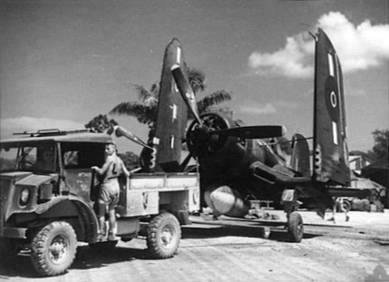 F4U-1 Corsair fighter of No. 16 Squadron Royal New Zealand Air Force being towed at Green Island (now Nissan Island), 21 Dec 1944