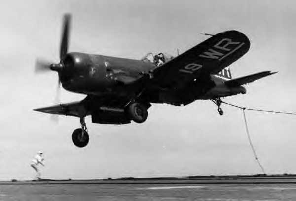 F4U-4B Corsair fighter of US Marine Corps squadron VMF-312 making a bad landing aboard a carrier, late 1940s