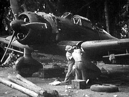 Mechanics performing maintenance on a D3A dive bomber, 1940s