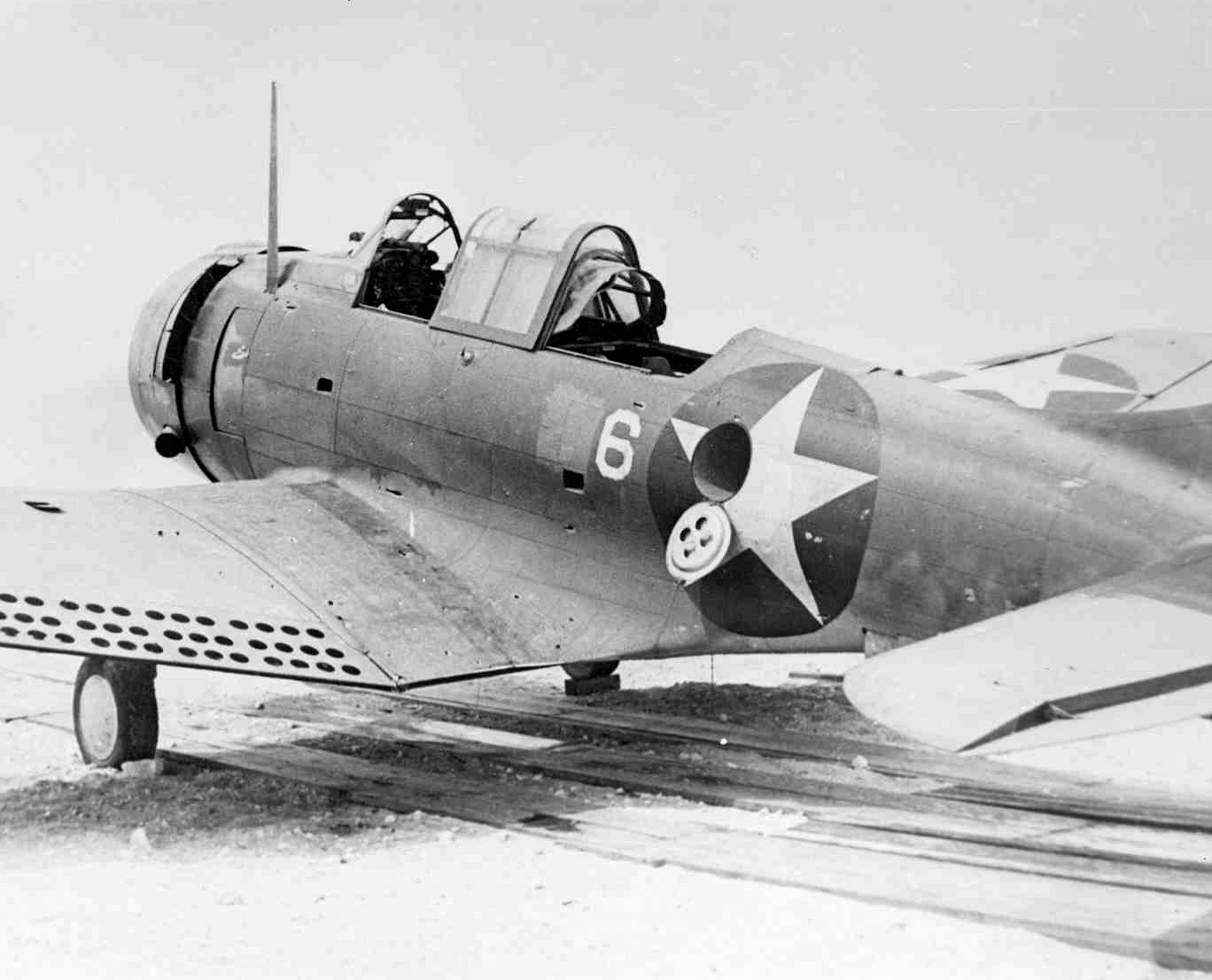 SBD-2 Dauntless aircraft of US Marine Corps squadron VMSB-241 at Midway Atoll, 4 Jun 1942, photo 2 of 2; note damage sustained during attack on Hiryu