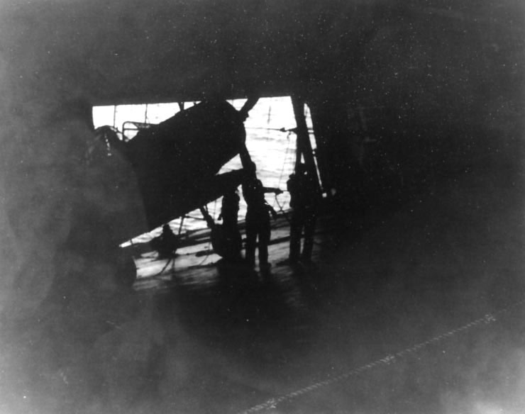 Crew of Yorktown prepared to jettison a TBD-1 Devastator bomber, 6 Jun 1942