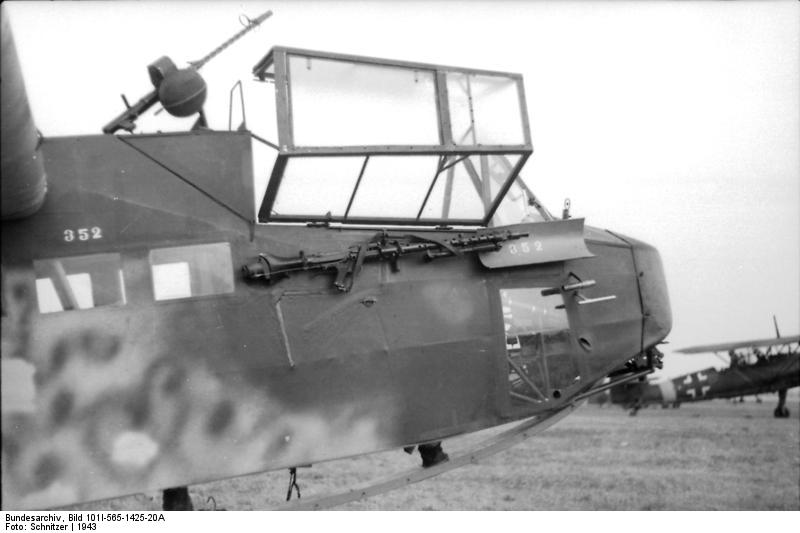 German DFS 230 glider with a MG 34 machine gun mounted on top of the aircraft and another stowed next to the cockpit, Italy, 1943; note Hs 126 aircraft in background