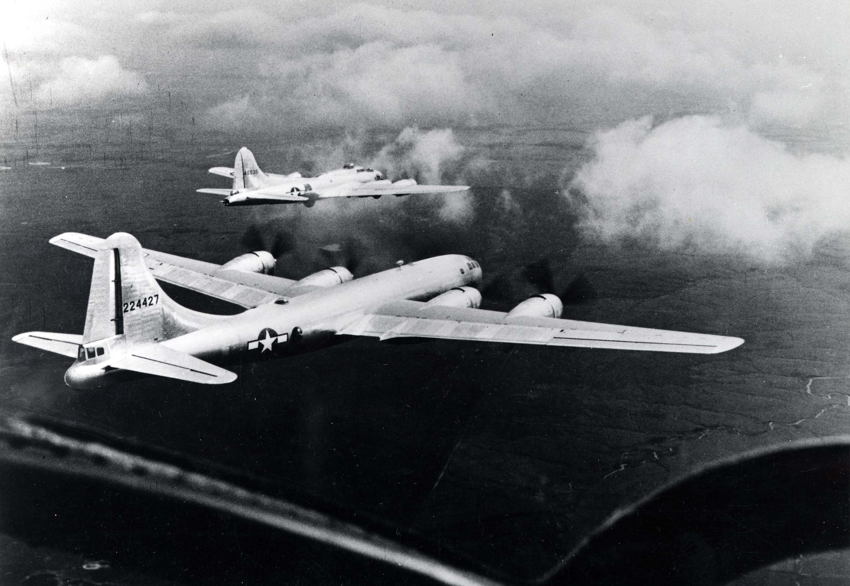 B-17 Flying Fortress bomber and B-29 Superfortress bomber in flight together during a test conducted by Boeing, circa late 1944, photo 2 of 3
