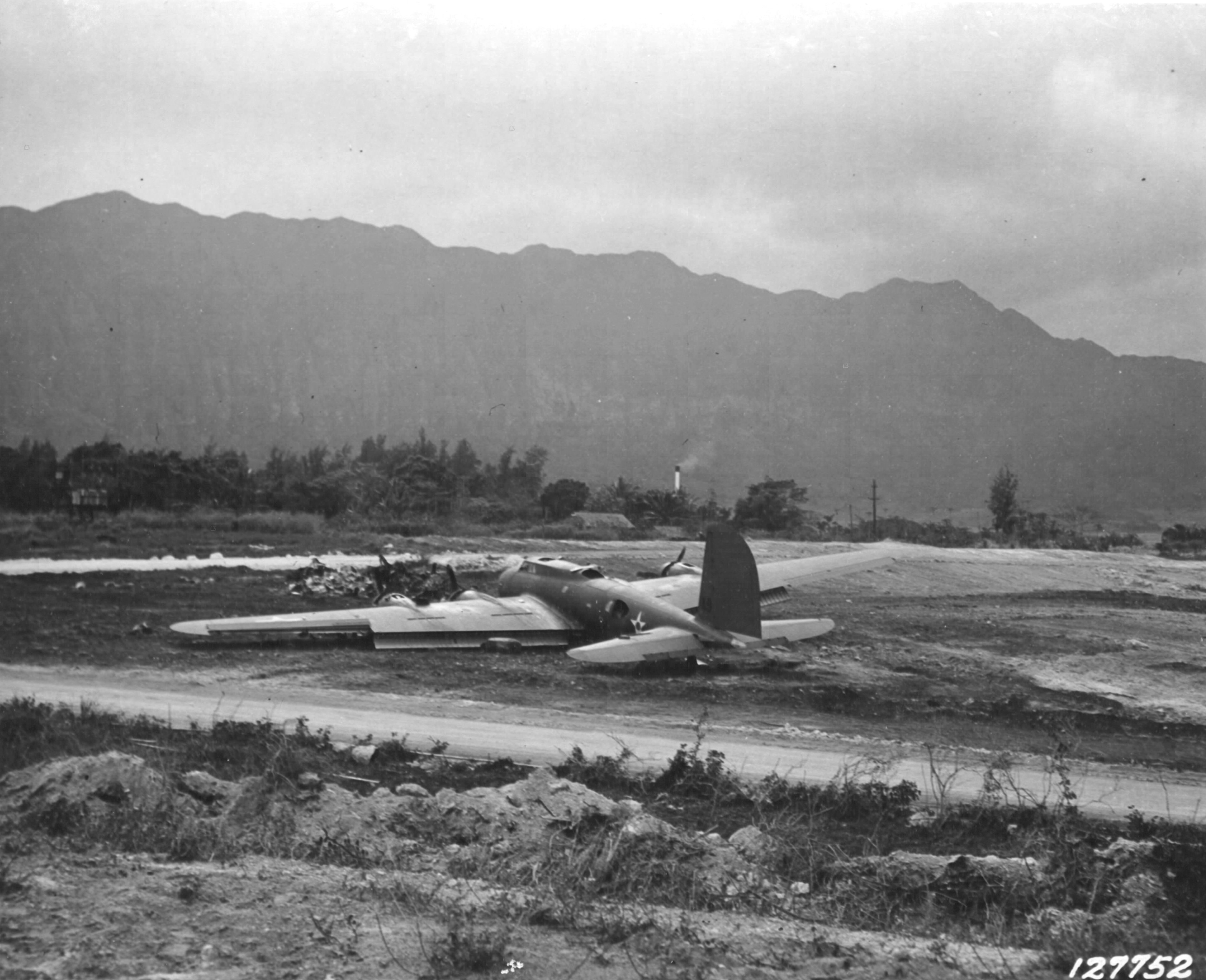B-17C Flying Fortress bomber at Bellows Field, Oahu, US Territory of Hawaii, 8 Dec 1941; she was forced to belly-land on previous day during Japanese attack