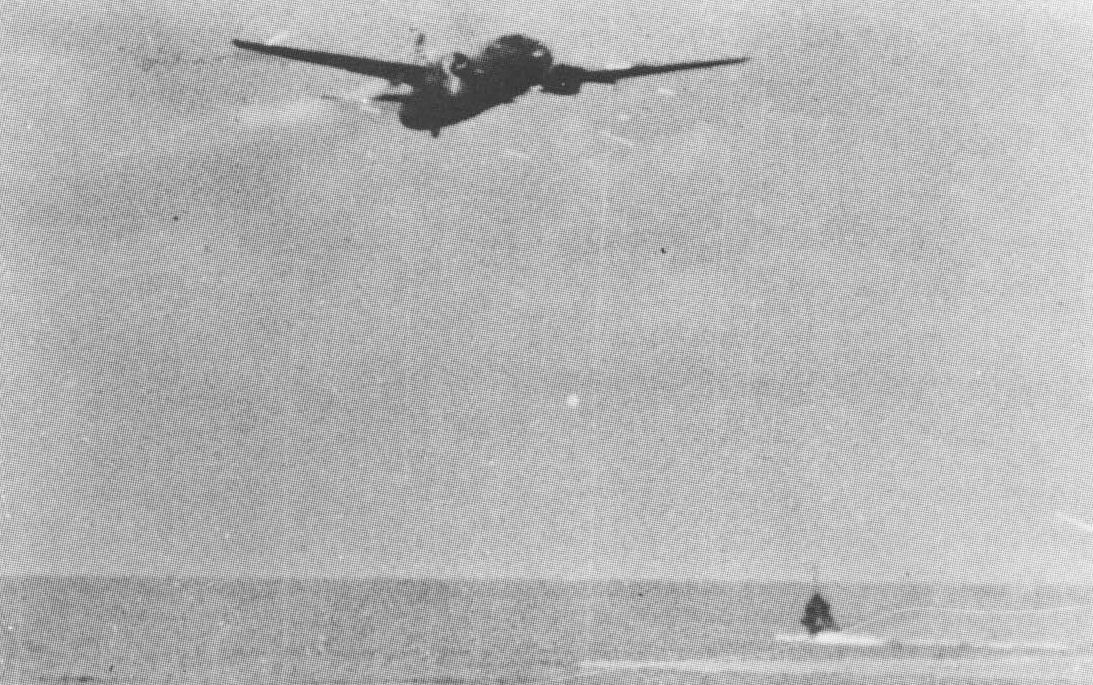G4M1 bomber of Japanese Navy 4th Air Group, piloted by Lieutenant Commander Takuzo Ito, moments before crashing into sea during attack on USS Lexington off Bougainville, Solomon Islands, 20 Feb 1942