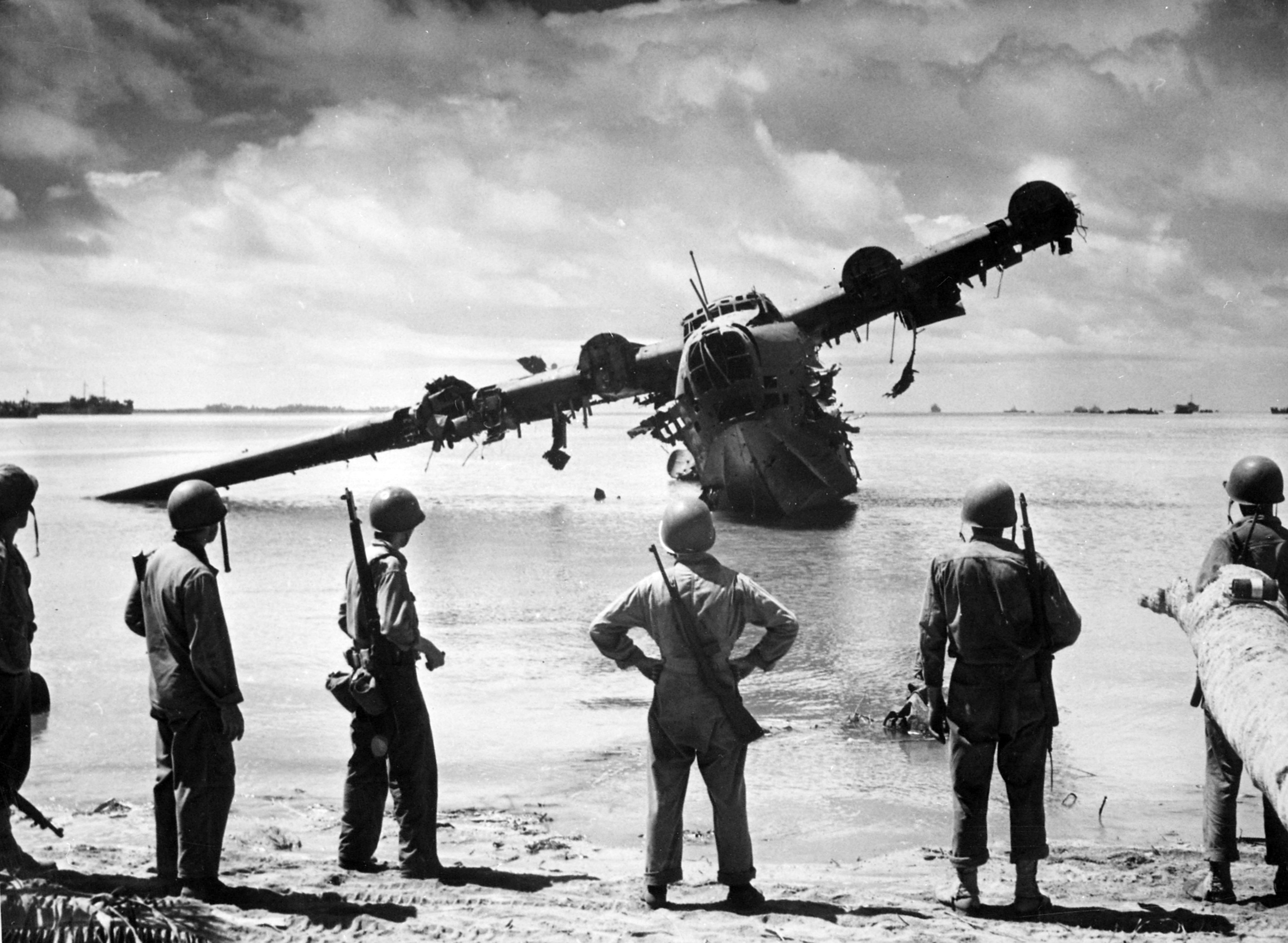 US Army troops looking at a wrecked H8K flying boat, Makin, Gilbert Islands, Nov 1943