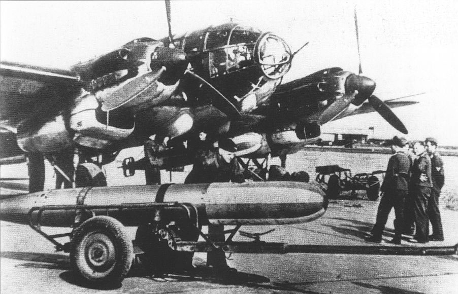 He 111 H-6 bomber, date unknown; note LT F5b practice torpedo in foreground and mounted under aircraft