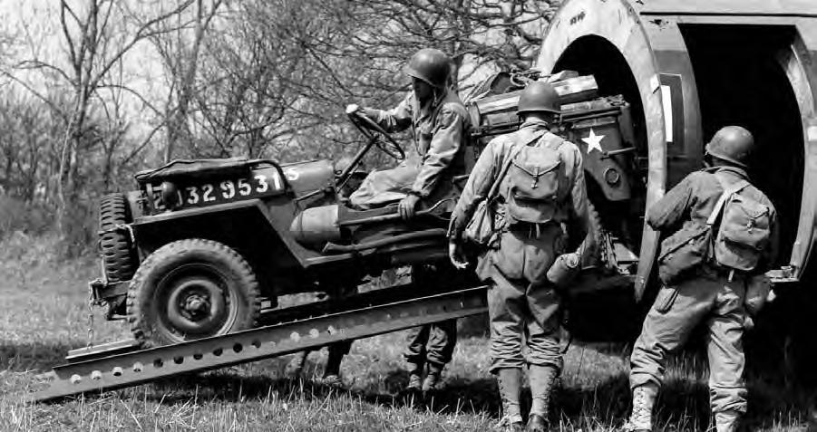 Stripped US Army airborne jeep exiting a Horsa glider, date unknown; note jeep's lack of ends of the front bumper, and some body and fender panels