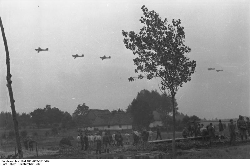 German Ju 87 Stuka dive bombers flying over German troops, Poland, Sep 1939