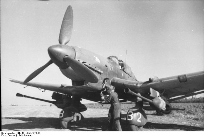 German Ju 87 Stuka dive bomber at rest, Russia, summer 1943; mechanic Hans-Ulrich Rudel was using a hand crank to start the engine; note 3.7cm FlaK 18 cannons installed under wings
