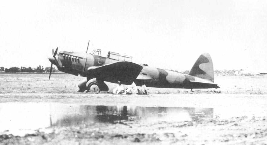 Ki-32 aircraft at rest, date unknown; note men resting beneath port wing