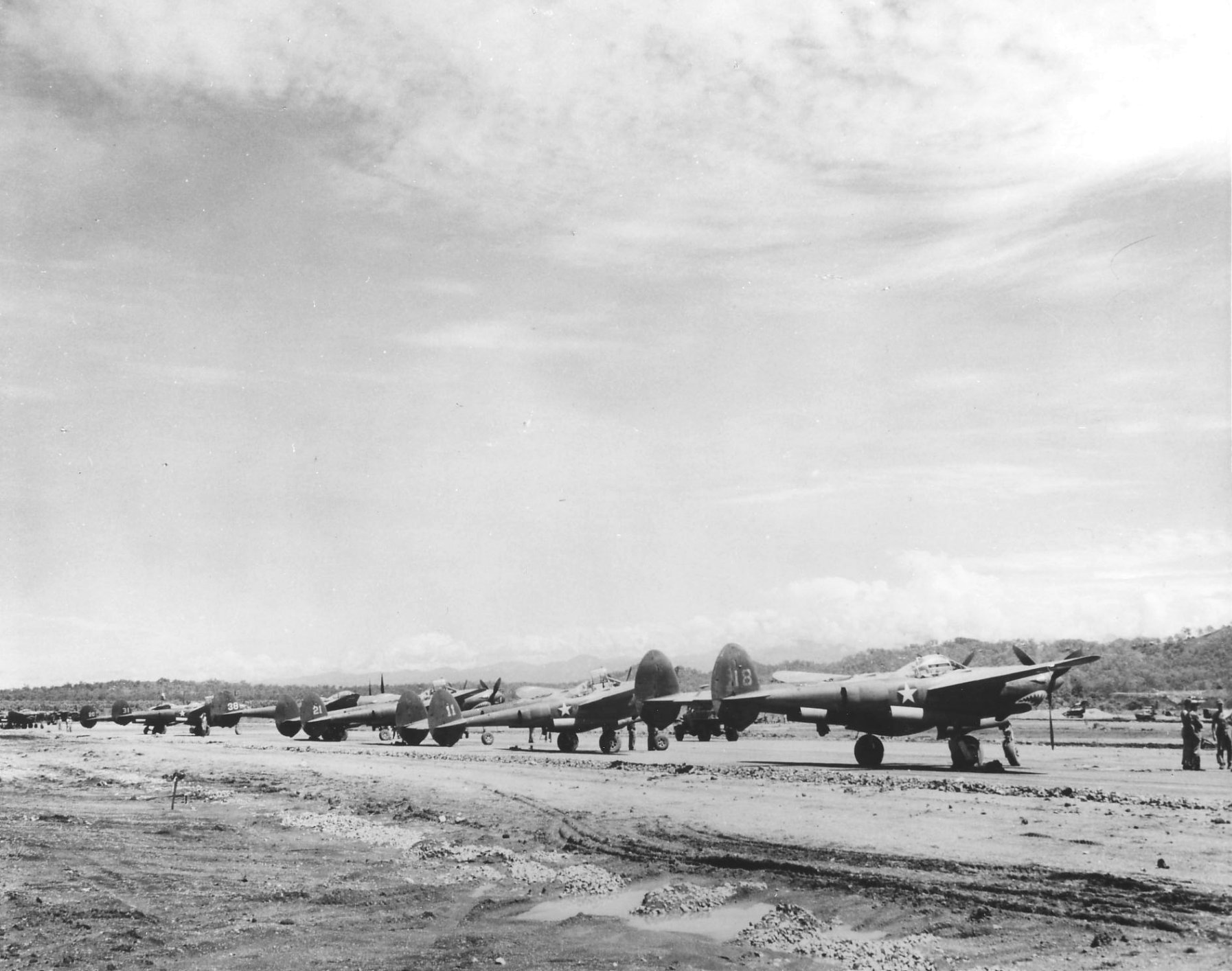 Line of P-38 Lightning escort fighters at Jackson Field, Port Moresby, New Guinea, 1942-1943
