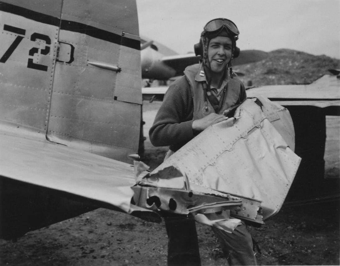 Captain Paul Hall and his damaged P-47D Thunderbolt fighter 'Dixie Gal' of 57th Fighter Group, US 64th Fighter Squadron at Grosseto, Italy, Oct 1944-May 1945