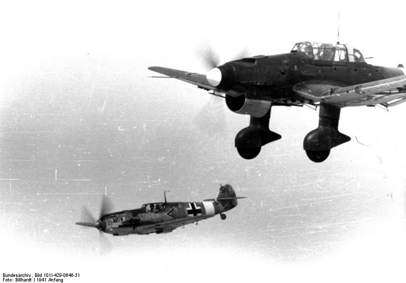 German Bf 109E fighter of I./JG 27 and Ju 87B Stuka aircraft of II./St G 2 in flight, early 1941