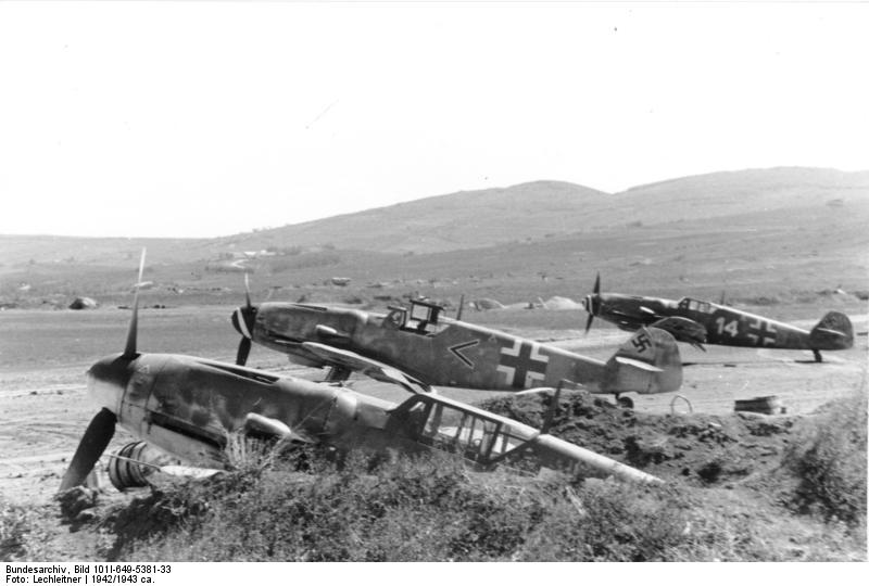 German Bf 109 fighters at rest on an airfield, possibly in Italy, circa 1942-1943
