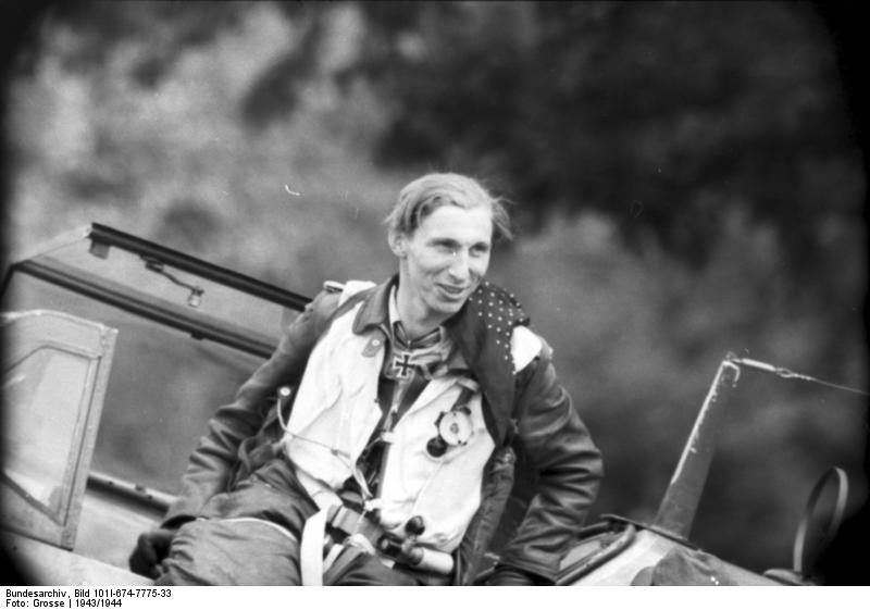 German pilot, probably Klaus Mietusch, exiting his Bf 109 fighter after a mission, 26 Mar 1944-18 Nov 1944, photo 2 of 2
