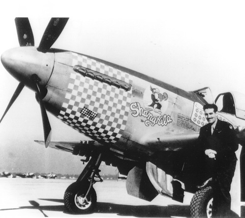 American pilot Captain Don S. Gentile posing in front of his P-51 Mustang fighter, during WW2