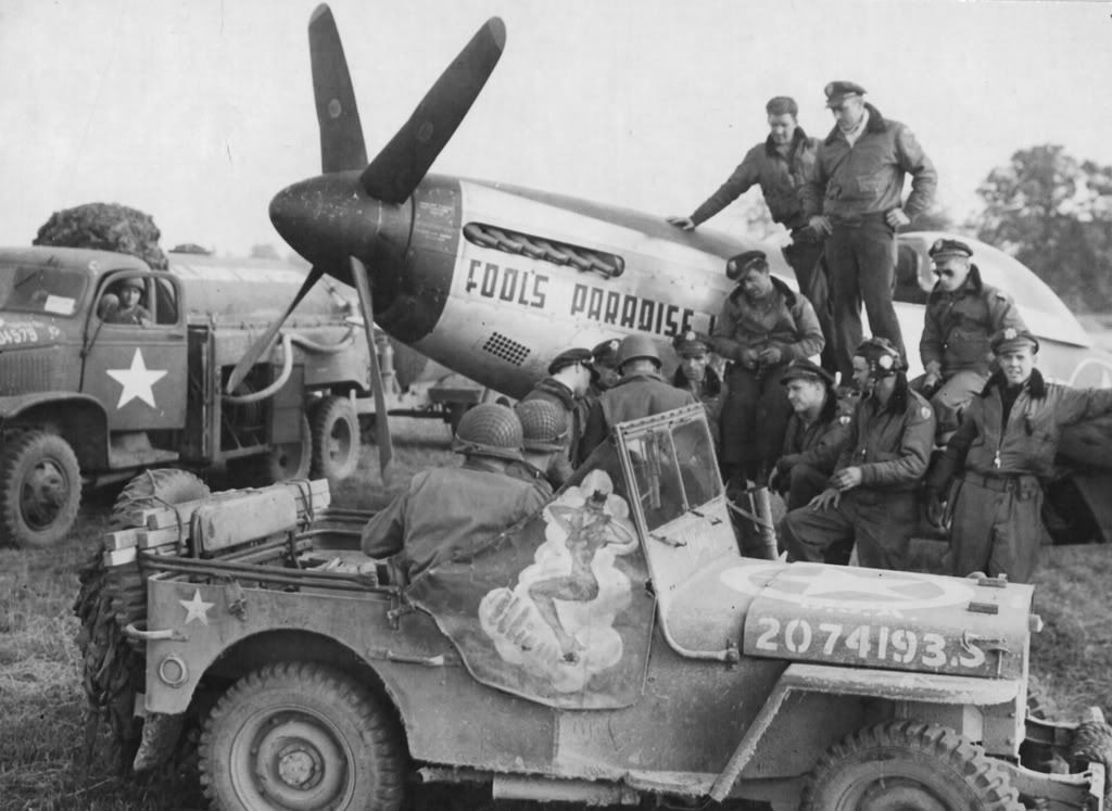US Pilots of 380th Fighter Squadron, 363rd Fighter Group with P-51D Mustang 'Fools Paradise IV' at Maupertus Airfield, Cherbourg, France, Jul-Aug 1944; note Jeep and CCKW fuel truck