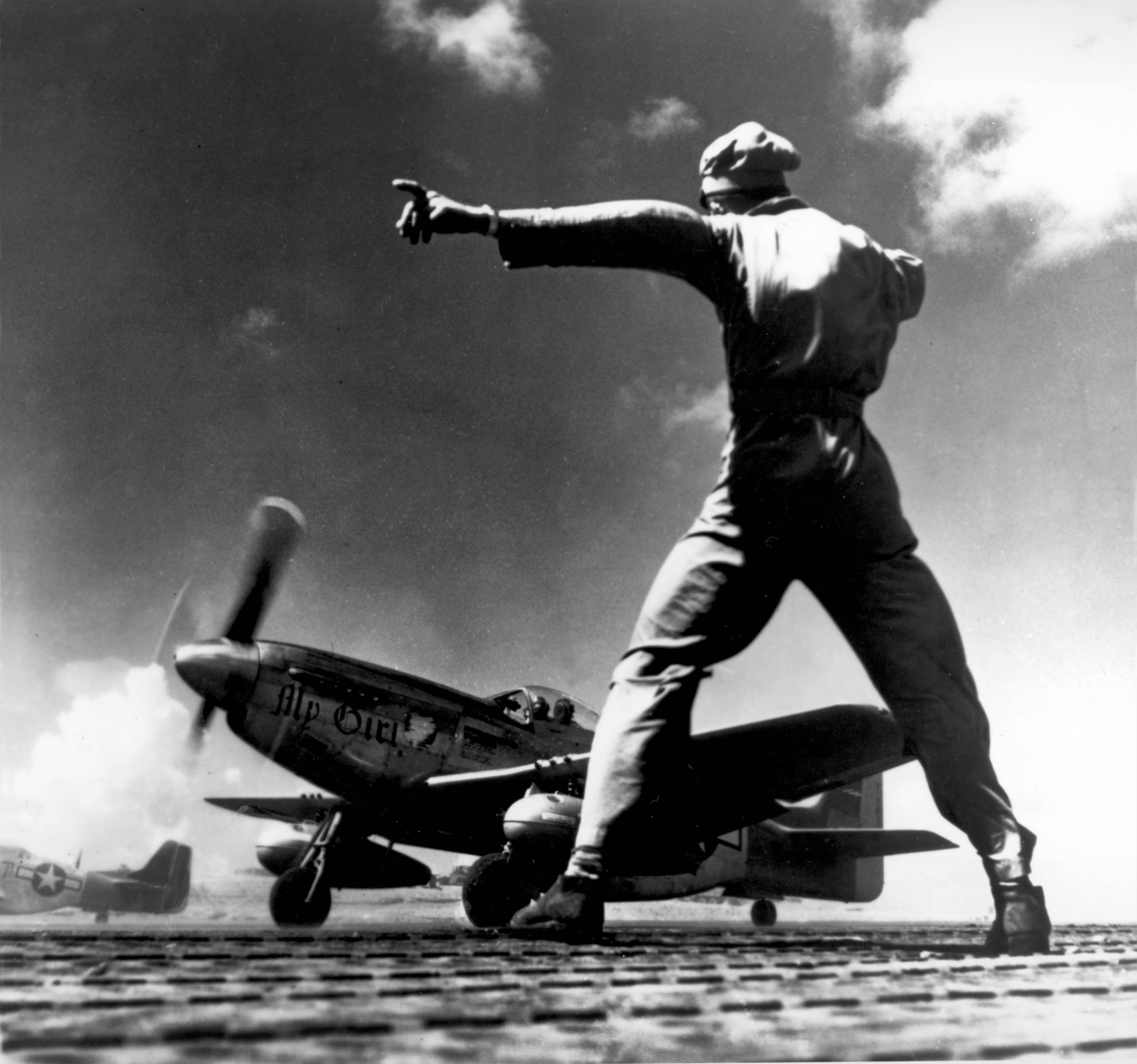 P-51 Mustang fighter 'My Girl' taking off from Iwo Jima, 1945