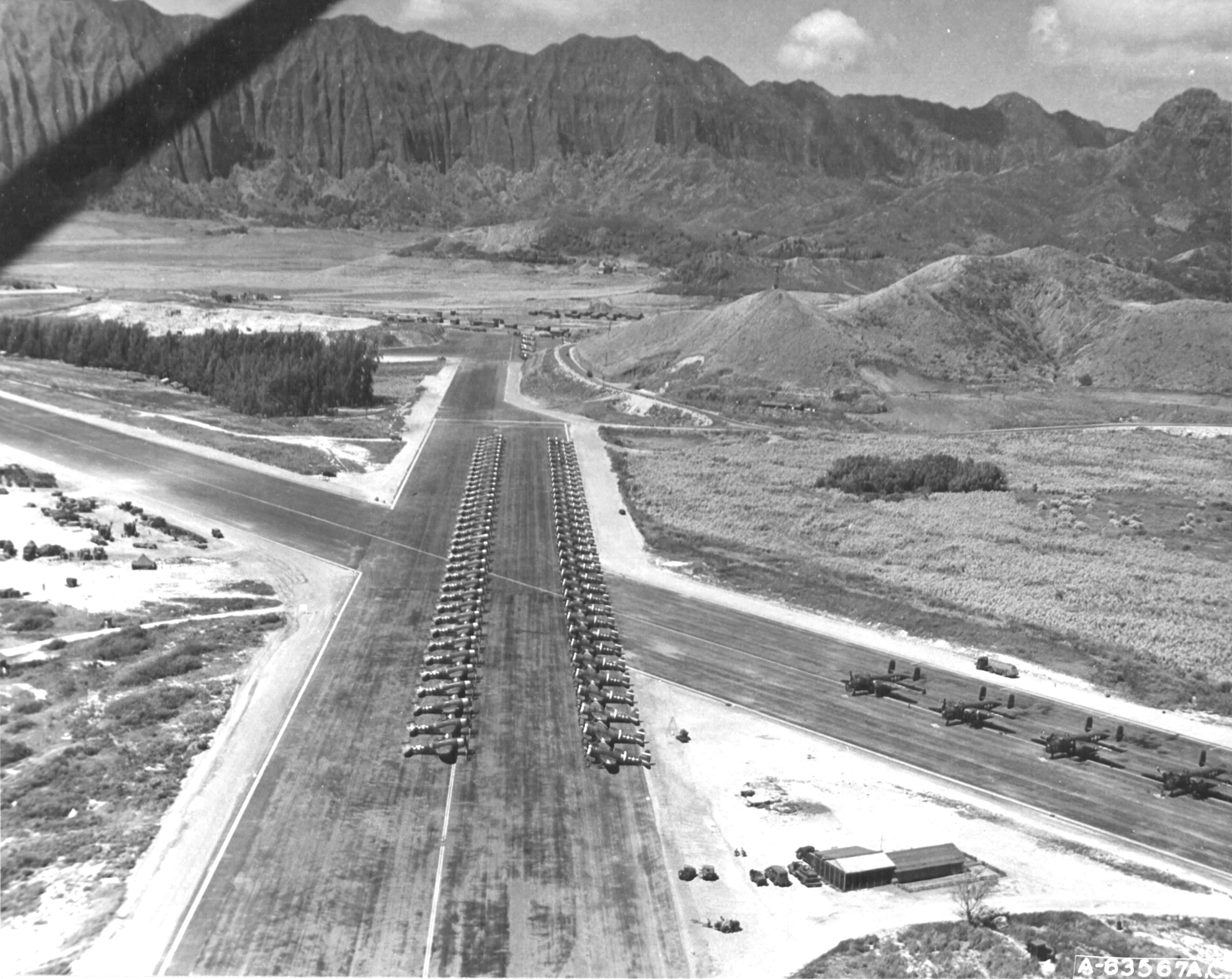 P-47 Thunderbolt aircraft of the 318th Fighter Group lined up for an inspection at Bellows Field, Oahu, US Territory of Hawaii, 15 May 1944. Photo 3 of 8.
