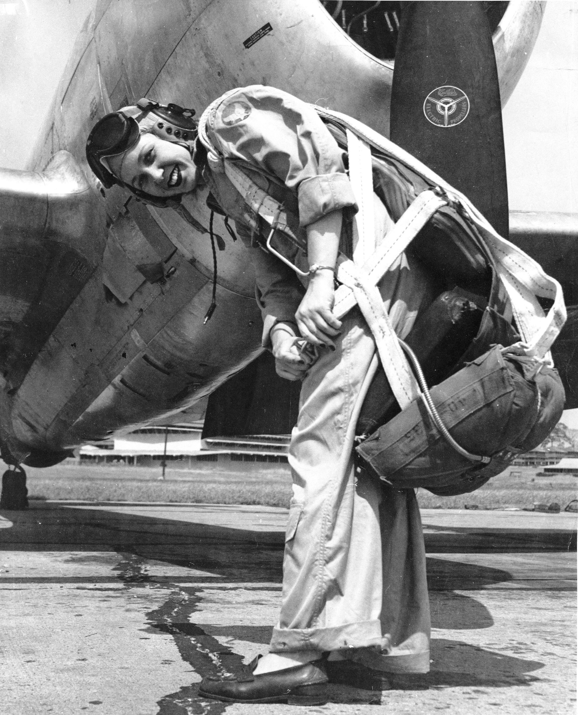 WASP pilot Deanie (Bishop) Parrish in front of her P-47 Thunderbolt aircraft, circa early 1940s