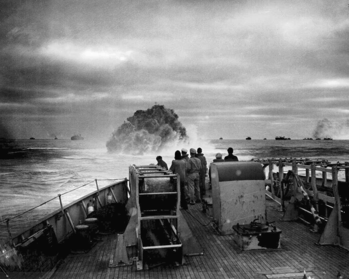 US Coast Guard crew of cutter Spencer watched as a depth charge exploded near U-175, North Atlantic, 500 nautical miles WSW of Ireland, 17 Apr 1943