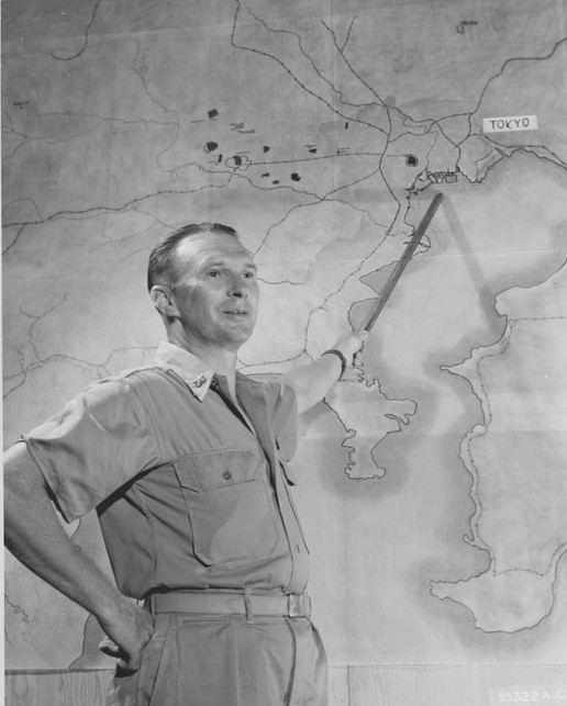 US officer pointing at Tokyo, Japan on an enlarged map during a bomber crews briefing, Saipan, Mariana Islands, late Nov 1944