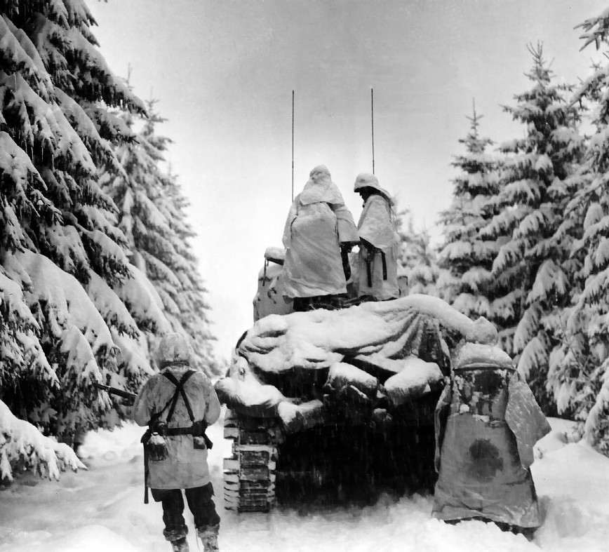 M4 Sherman tank and troops of Company G, 740th Tank Battalion, 504th Regiment, US 82nd Airborne Division operating in snowy conditions, near Herresbach, Belgium, 30 Dec 1944-11 Jan 1945