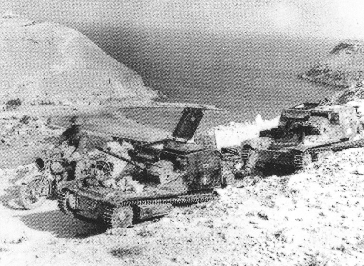 Abandoned Italian L3 and L3 cc tankettes on the road overlooking Bardia Harbor, Libya, Jul 1941