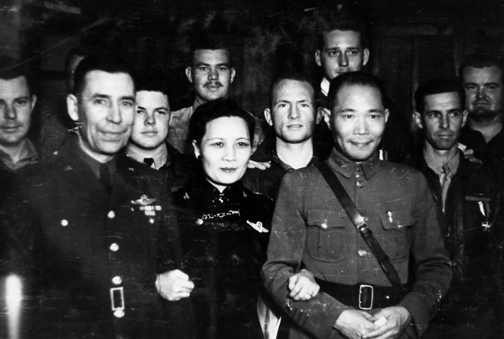 Song Meiling with Doolittle Raiders Frank Kappeler, Kenneth Reddy, Lucian Youngblood, Eugene McGurl, Rodney Wilder, and others, Chonging, China, 29 Jun 1942